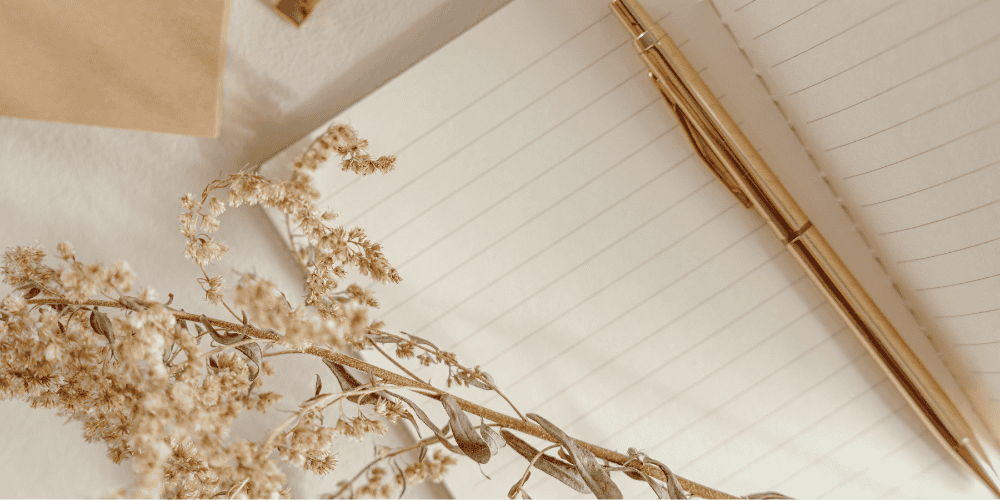 achieve-your-goals Open notebook with a pen to demonstrate writing down your Magic 20 List to achieve your goal