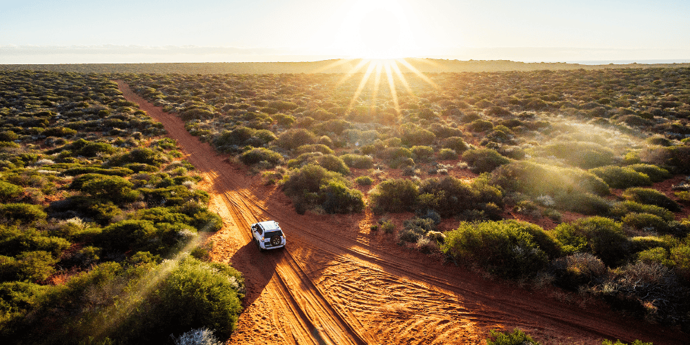 leave-your-comfort-zone car driving off the beaten path to demonstrate leaving your comfort zone