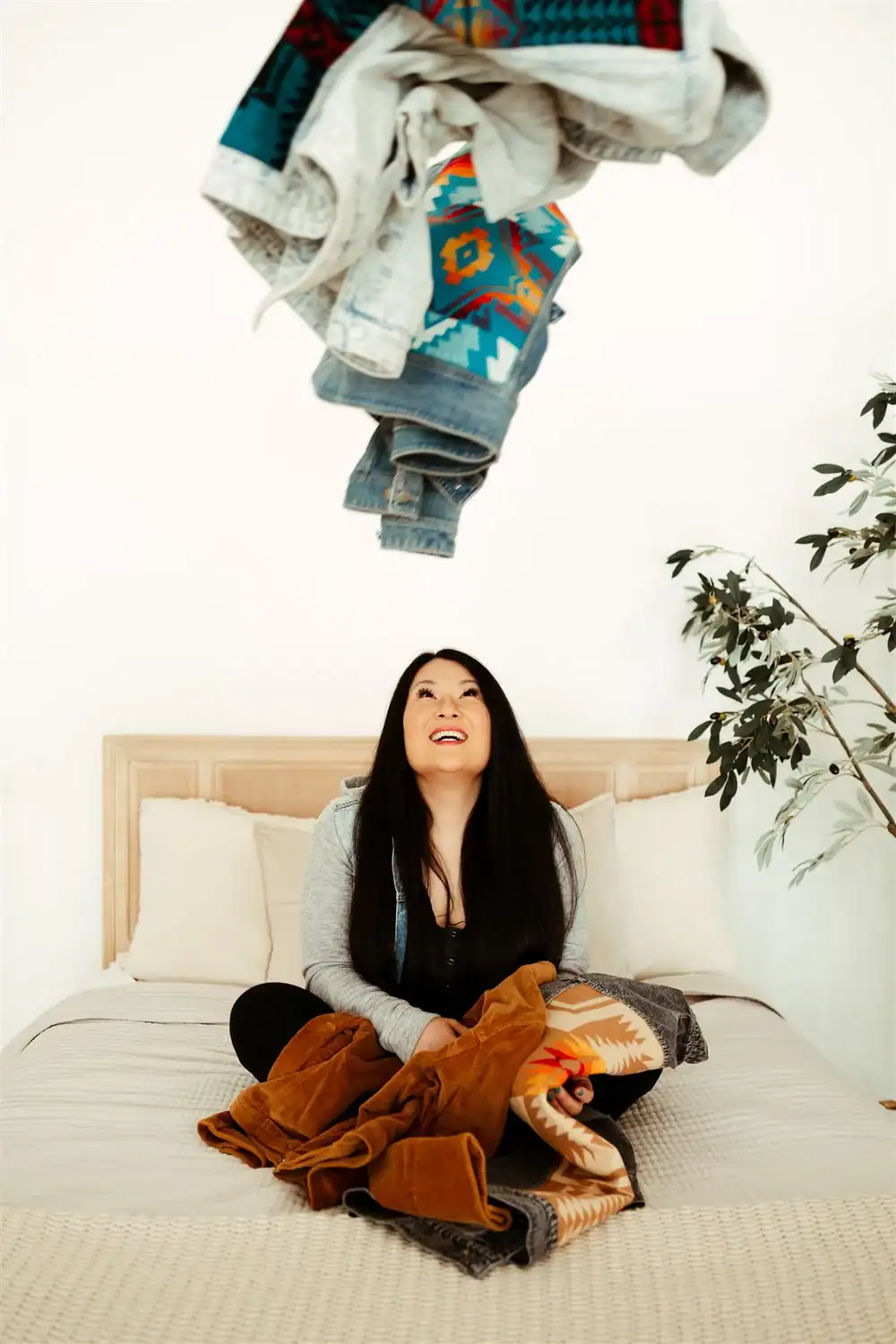 Kelly and her custom jackets demonstrating how you can start a business at any age