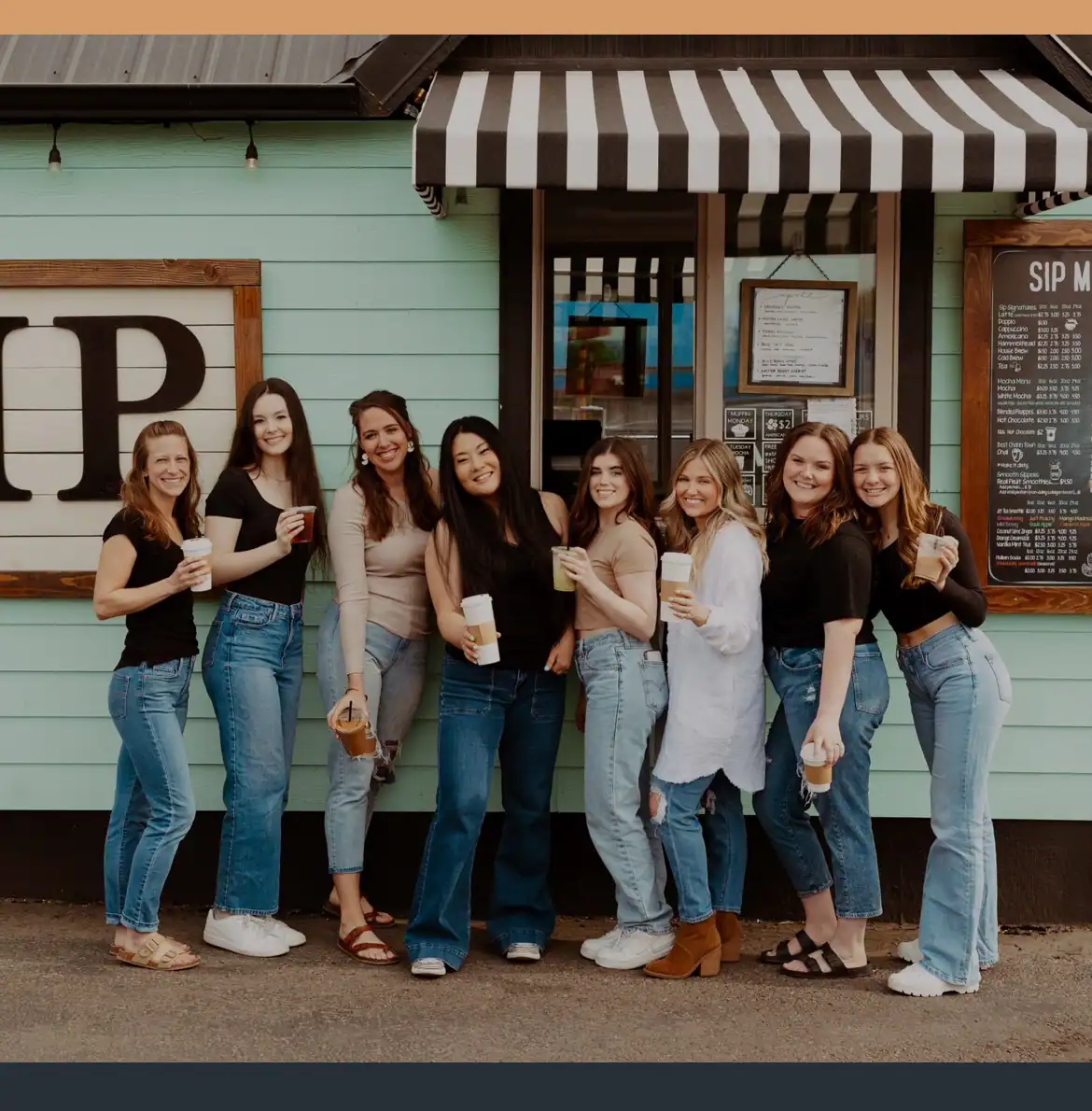 Kelly and her staff in front of her coffee stand showing how it's possible to own your own business