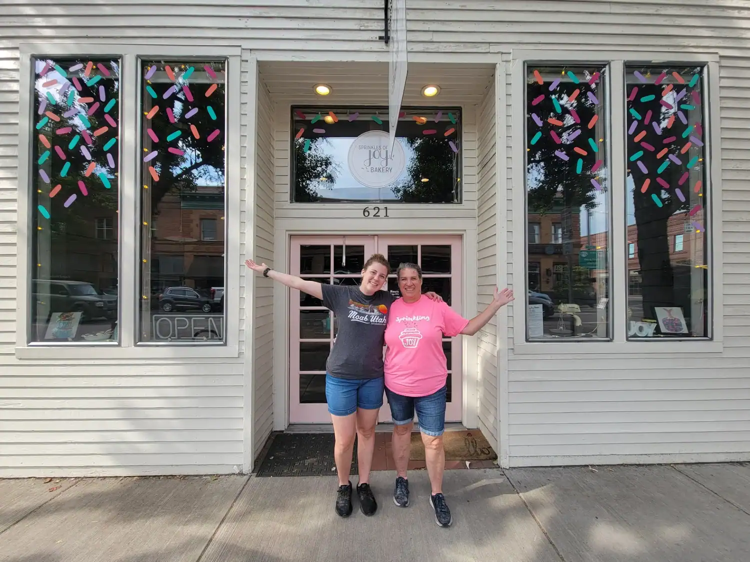 Kelly and her mom, Karen, in front of their bakery Sprinkles of Joy to prove it's possible to become a bakery business owner
